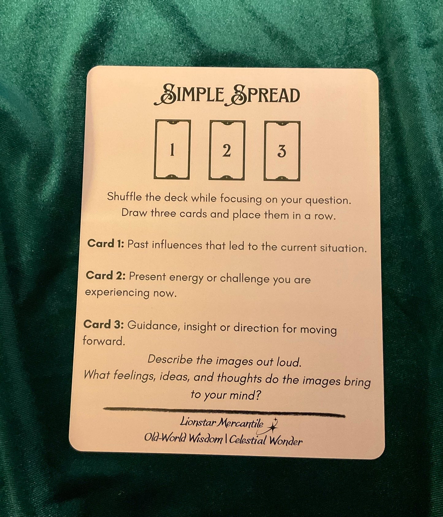 Card with instructions for a simple spread on a green fabric background